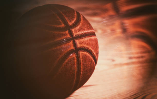 istock basketball ball on black background. 1205569557