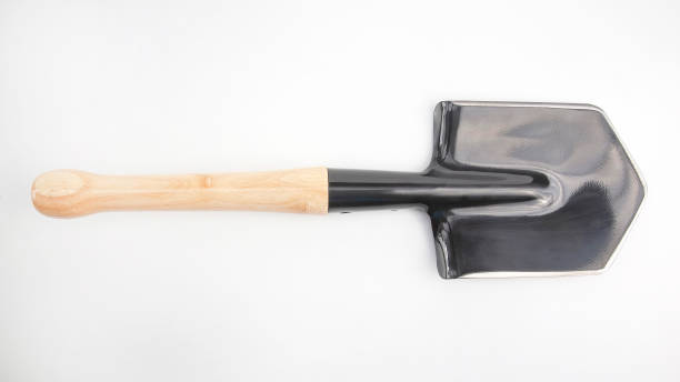 istock small shovel for tourism and earthworks on a white background 1205570499