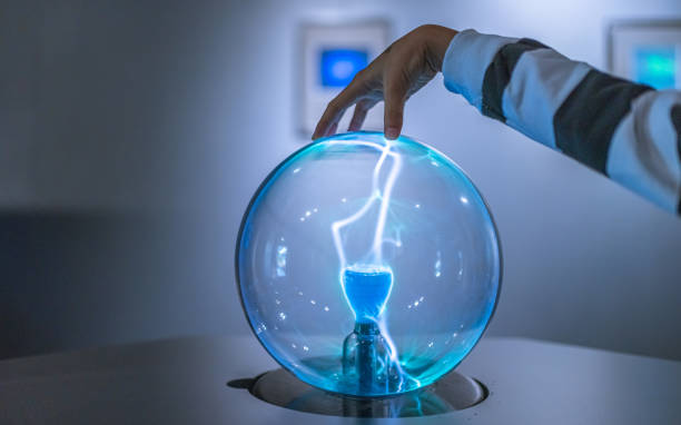 Science Photo Touching On Electrostatic Magic Ball plasma ball stock pictures, royalty-free photos & images