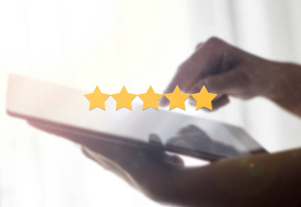 5 star review in survey, poll or customer satisfaction research with digital tablet stock photo