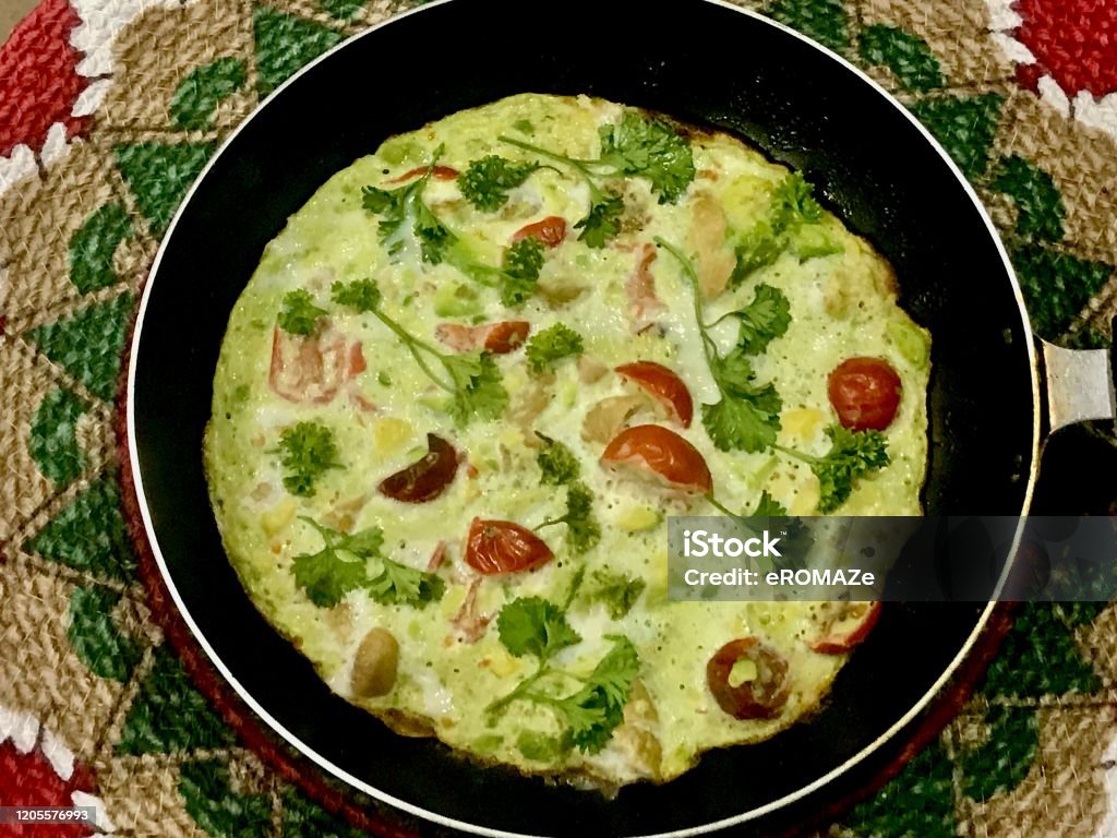 Avocado Omelette Avocado Omelette with parsley and cherry tomatoes garnishing. Avocado Stock Photo