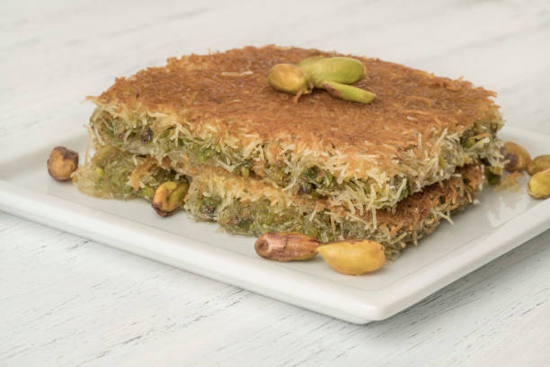 istock traditional Turkish dessert kadayif with pistachio on table 1205580303
