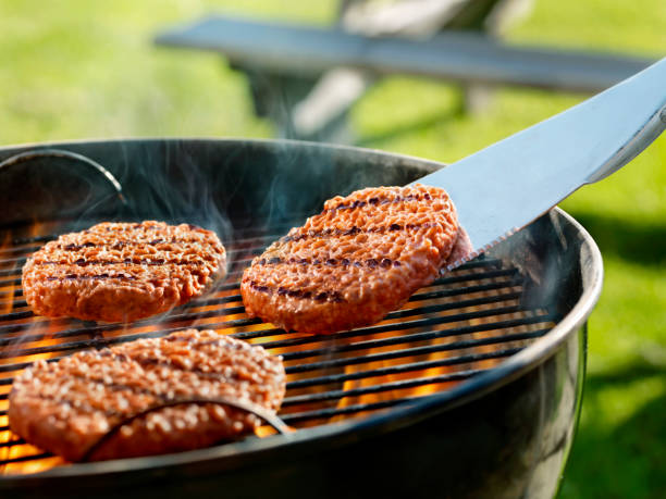 istock Cooking Burgers on a Backyard BBQ 1205580493