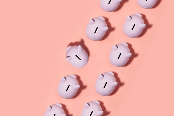istock Piggy Bank on Pink Background 1205583333