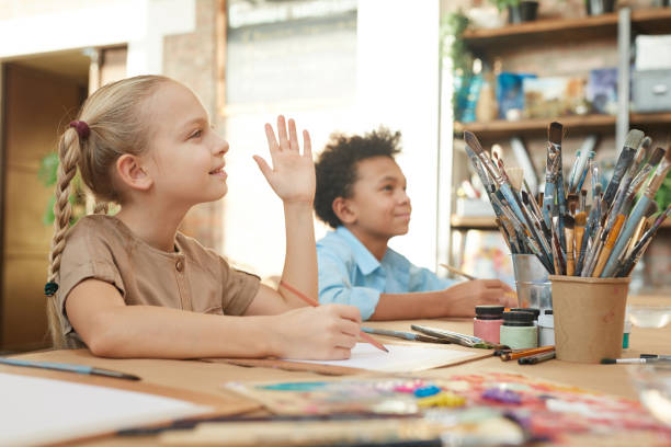 istock Children sitting at art lesson 1205583478