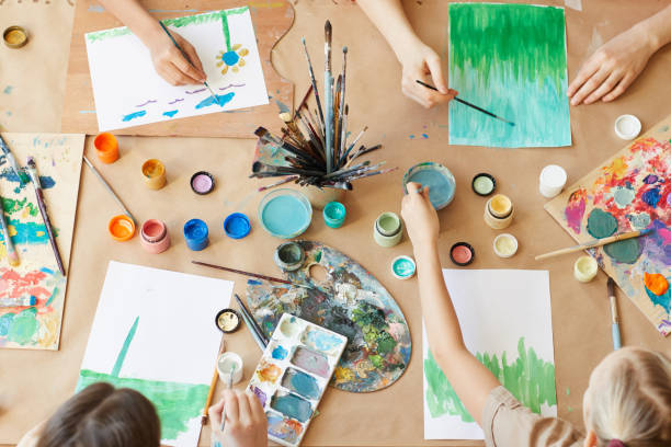 istock Children painting at the table 1205584237