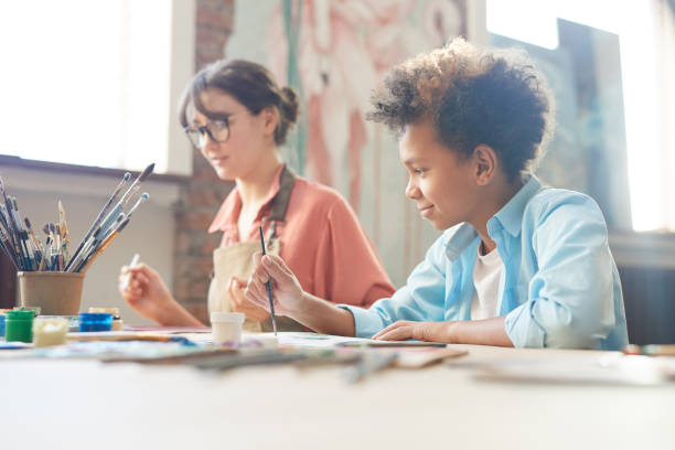 istock People painting at the table 1205584251