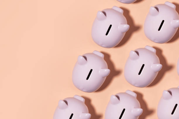 istock Piggy Bank on Pink Background 1205584314