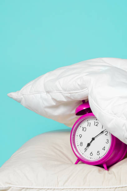 istock Alarm clock under the pillow - Don't want to wake up concept 1205584417