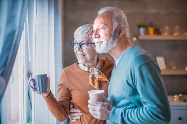 istock Beautiful senior couple drinking coffee. 1205584784
