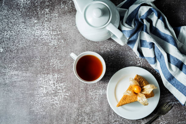 istock Honey cake with caramel cream filling decorated with physalis 1205584787