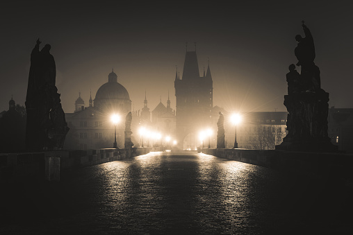 Dramatic View of the Charles Bridge in Prague on Misty Night.