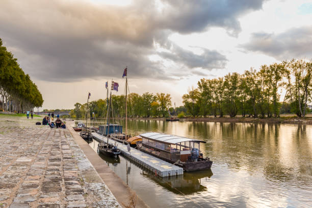 City of Orleans in France Orleans, France, October 10, 2019: Traditional sailing ship along Orelans quay in the river Loire during sunset orleans france photos stock pictures, royalty-free photos & images