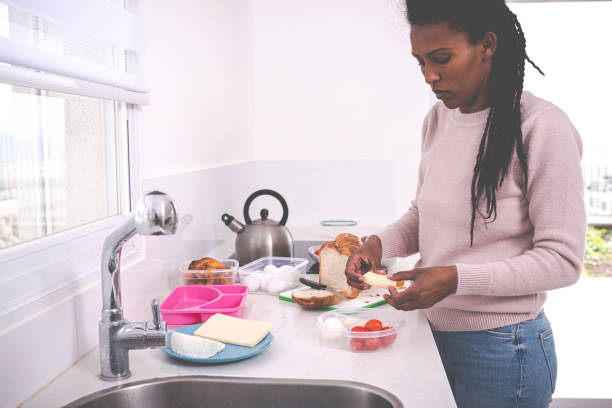 istock Woman preparing school breakfast. 1205589804