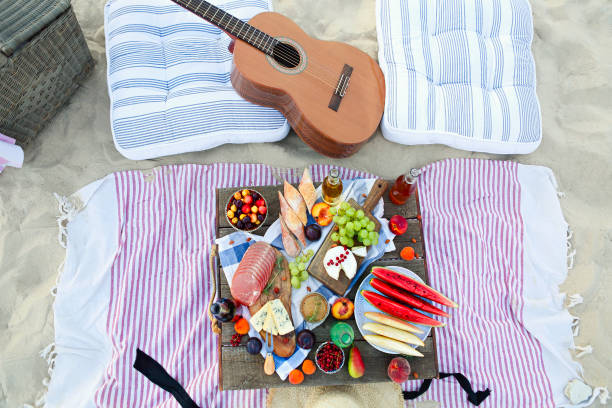 istock Picnic on the beach at sunset in the style of boho 1205589844