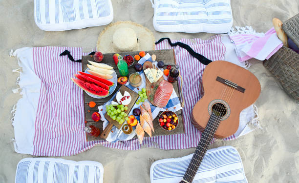istock Picnic on the beach at sunset in the style of boho 1205589983