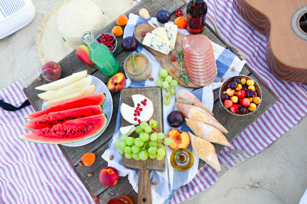 istock Picnic on the beach at sunset in the style of boho 1205590004