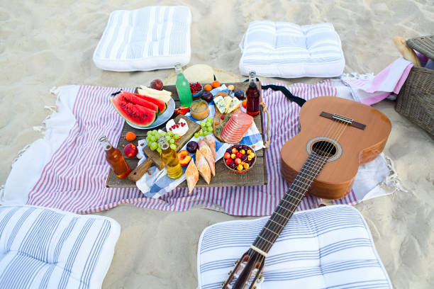 istock Picnic on the beach at sunset in the style of boho 1205590175