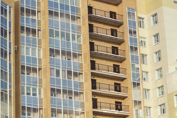 istock Plastic windows in a modern tiled brick high-rise house 1205590850