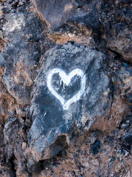 Rock with a heart painted White color