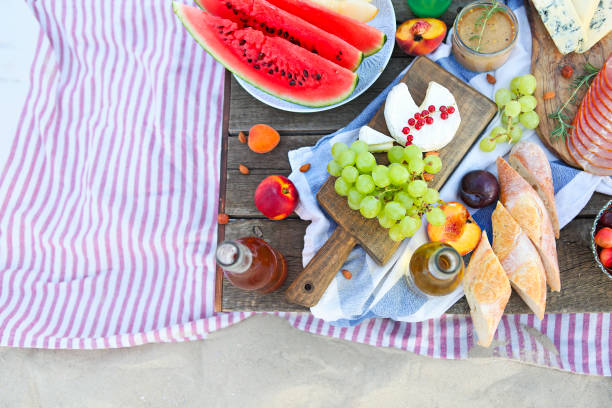 istock Picnic on the beach at sunset in the style of boho 1205592131