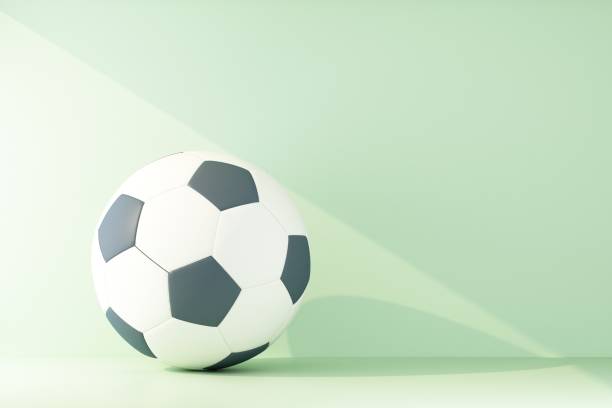 istock soccer ball lit by a ray of light 1205592210