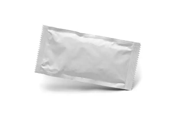 Blank White Condiment Packet Floating Isolated on White Background.