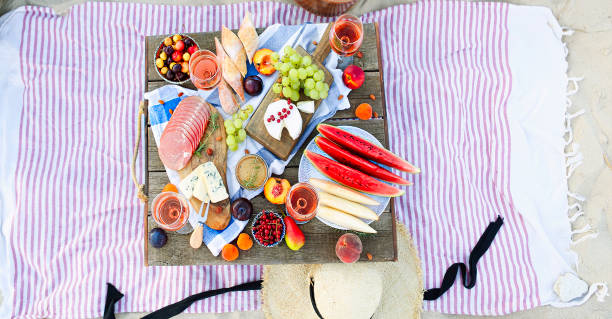 istock Picnic on the beach at sunset in the style of boho 1205592695