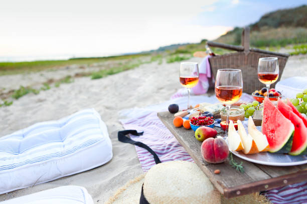 istock Picnic on the beach at sunset in the style of boho 1205592718