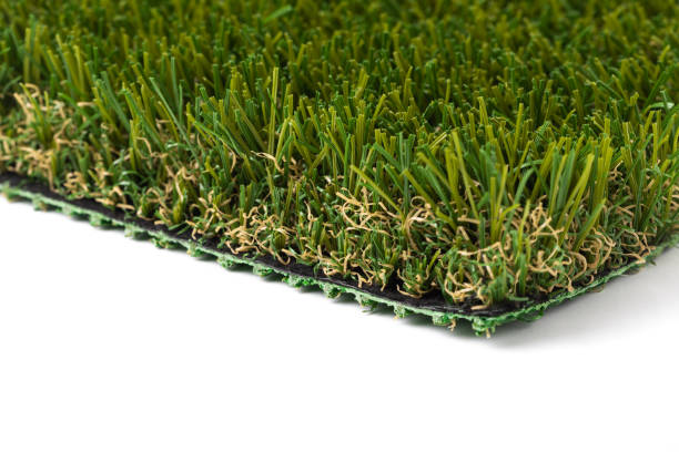 istock Section of Artificial Turf Grass On White Background 1205592762