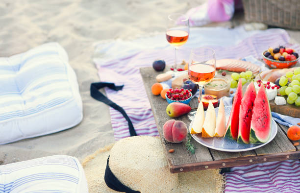 istock Picnic on the beach at sunset in the style of boho 1205592906