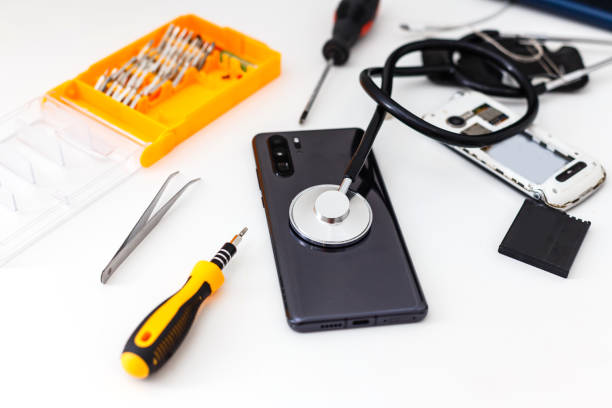 istock diagnostic of gadgets on white background with stethoscope 1205592932