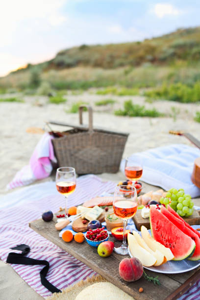istock Picnic on the beach at sunset in the style of boho 1205593526