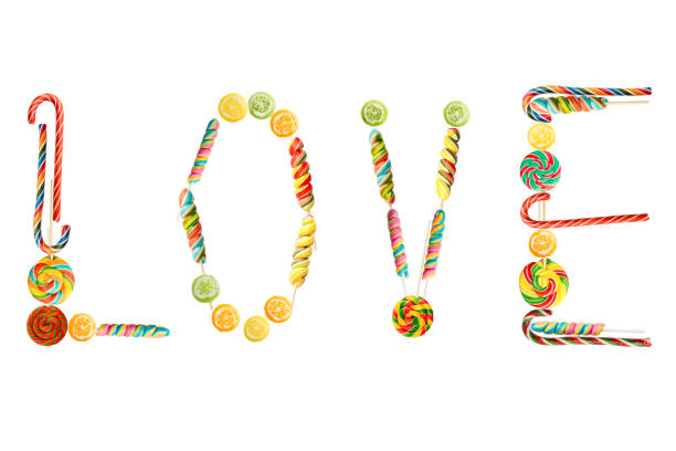 word Love from colorful candy canes isolated on white background. caramelized candies, lollipops for design greeting cards for Valentines day, mothers day.