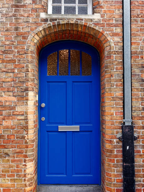 istock old blue exterior door in brick wall 1205600166