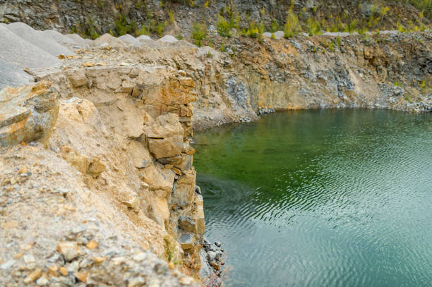 istock flooded pit mining or quarry with beautiful blue water. 1205600301