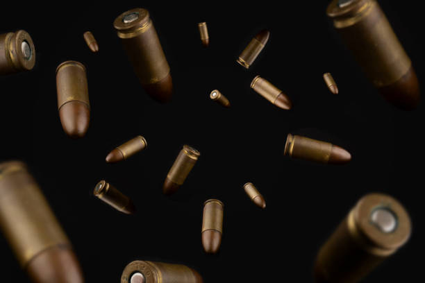 Explosion of gun bullets Composition of pistol bullets criminal activity stock pictures, royalty-free photos & images