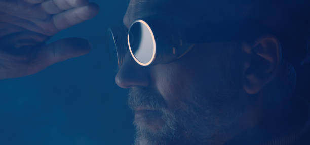 istock Man in safety goggles looking away 1205603241