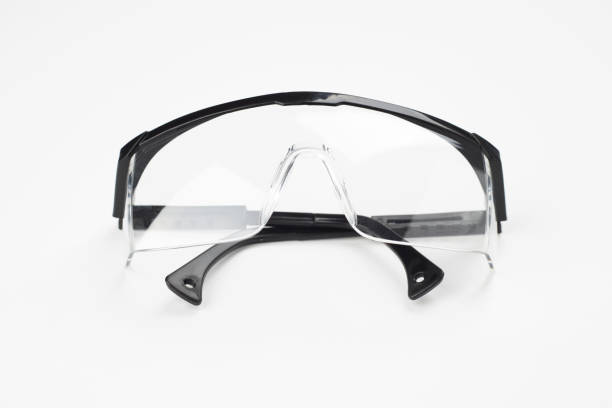 istock black plastic protection glasses isolated on white background. workwear concept. 1205603474