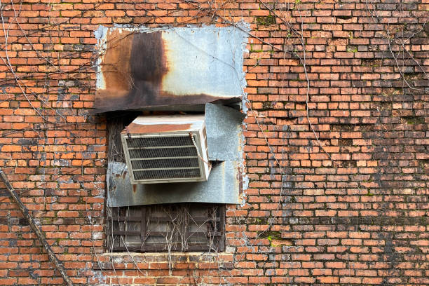 istock rusty old air conditioner vintage red brick wall 1205607610
