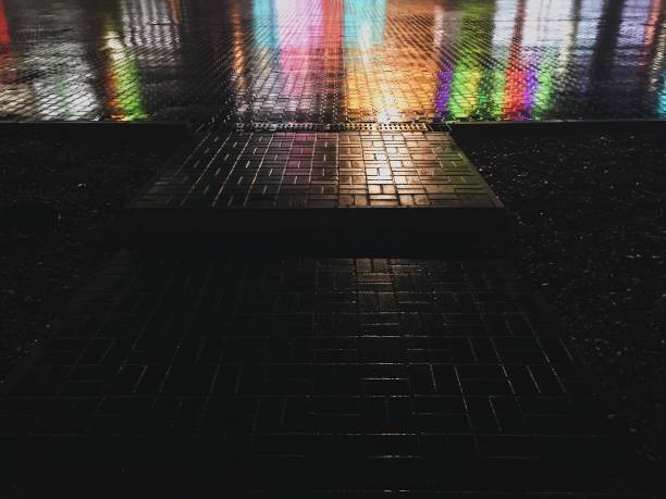 istock Abstract colorful background. Wet asphalt texture 1205610017