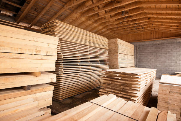 istock Pile of planks wood material for carpentry and construction. 1205610478
