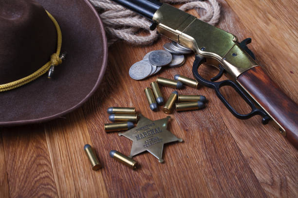 istock Wild west rifle, ammunition and sheriff badge 1205614686