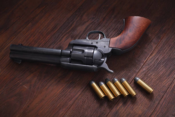 istock Old western revolver with cartridges 1205615764