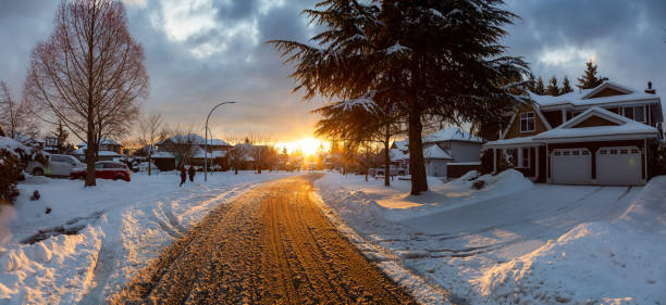 Residential Neighborhood in the Suburbs during a Dramatic Colorful Sunrise Residential Neighborhood in the Suburbs during a Dramatic Colorful Sunrise after Big Snowfall. Taken in Fraser Heights, Surrey, Vancouver, BC, Canada. surrey british columbia stock pictures, royalty-free photos & images