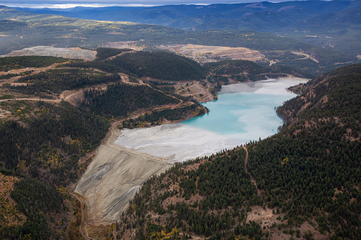 Aerial view of Copper Mine Tailing pond in the interior British Columbia, Canada. Taken during a fall season morning.
