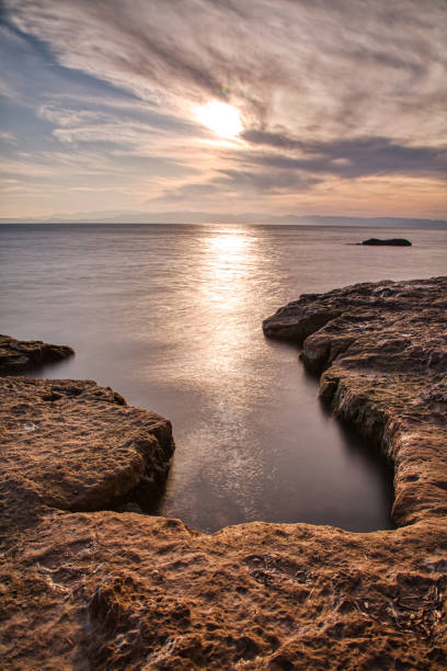 istock long exposure of seaside cliffs at sunset 1205620140
