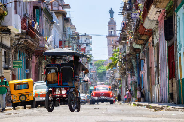 Beautiful Street view of the Old Havana City, Capital of Cuba Havana, Cuba - May 28, 2019: Beautiful Street view of the Old Havana City, Capital of Cuba, during a bright and sunny day. old havana stock pictures, royalty-free photos & images