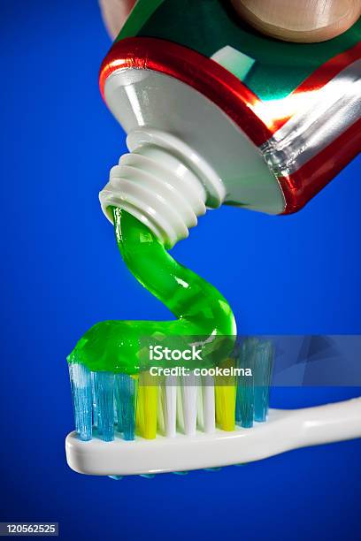 Toothpaste Being Squeezed Onto A Toothbrush Stock Photo - Download Image Now - Blue, Body Care, Bristle - Animal Part