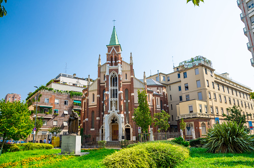 San Camillo De Lellis catholic church with green lawn foreground in Milan city centre, Lombardy, Italy